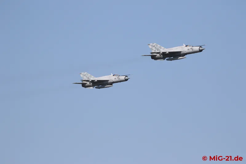 Shortly after arriving on the other side of the runway, the two MiG-21s already come back for a flypast, ...