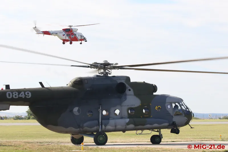 Lining up for the formation flight. The white and red W-3A in the background led the formation; the Mi-17, …