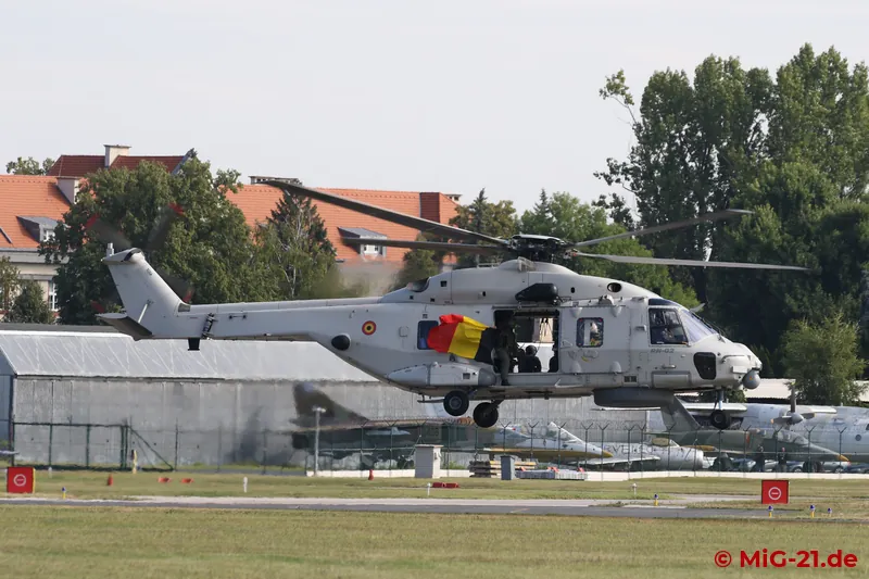 The crew of the Belgian NH-90 shows the flag.