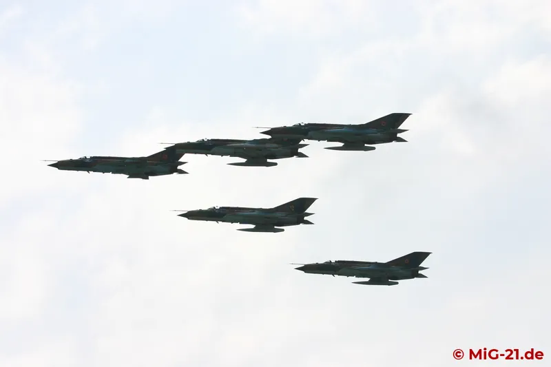 ... of a fly-pass of one five-ship and one four-ship formation ...