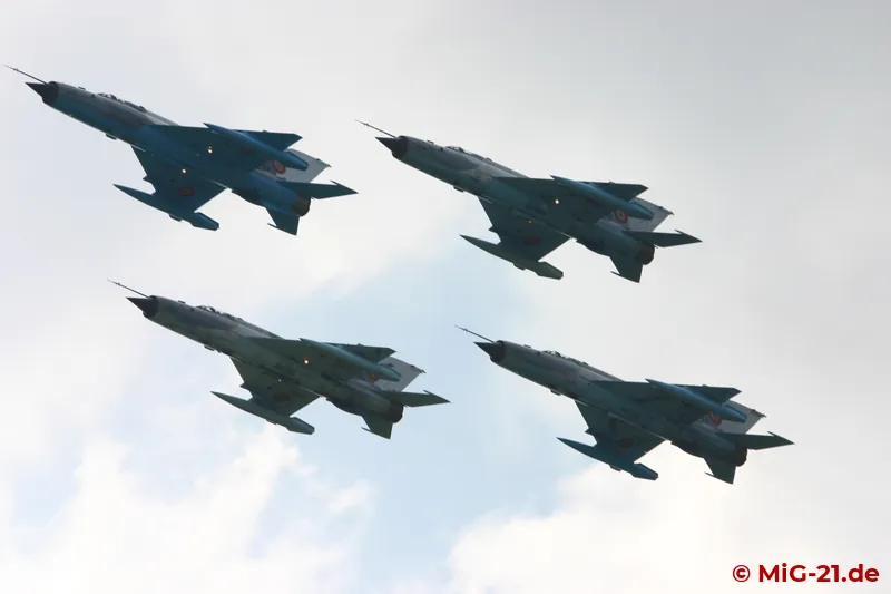 ... of a fly-pass of one five-ship and one four-ship formation ...