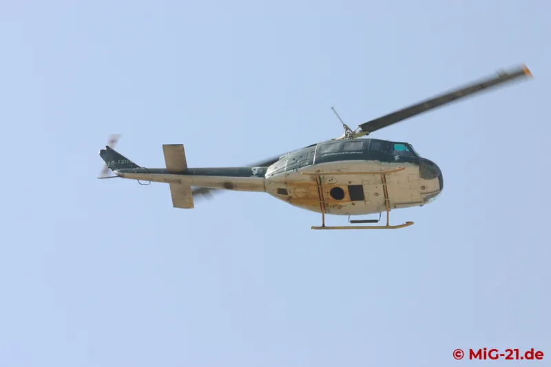 A Pasdaran AB.205 / UH-1 circled over the scene.
