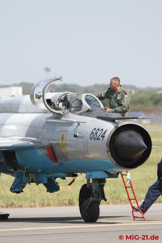 After the work is done, GICA Stancu climbs out of his aircraft.