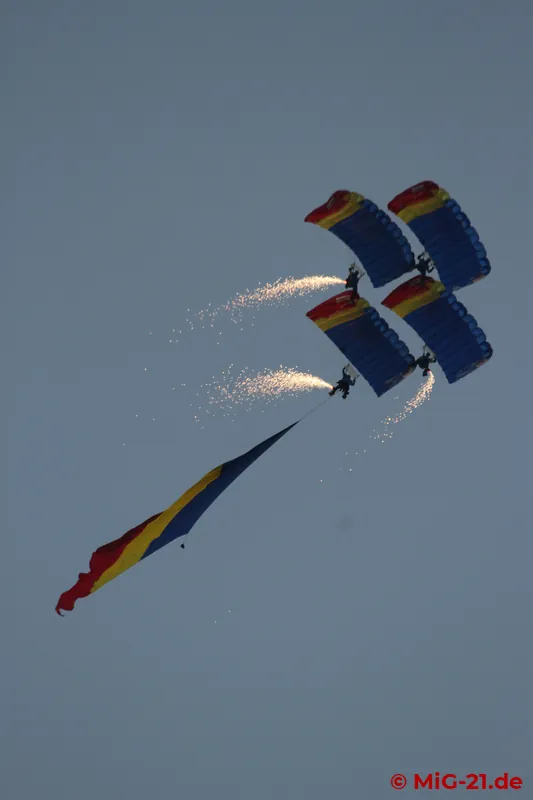 ... and provided the backdrop for the evening and night programme, which was opened by parachutists with …