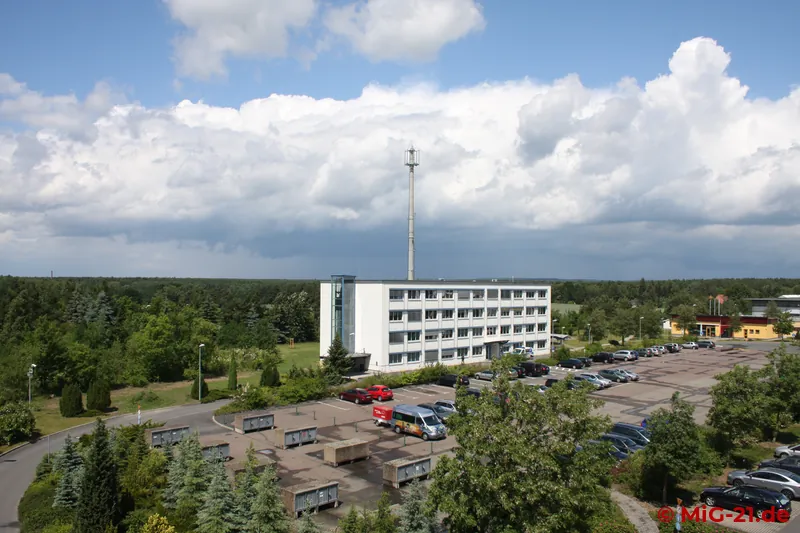 The author remembers the car park in front of the building mainly because morning exercises "without …