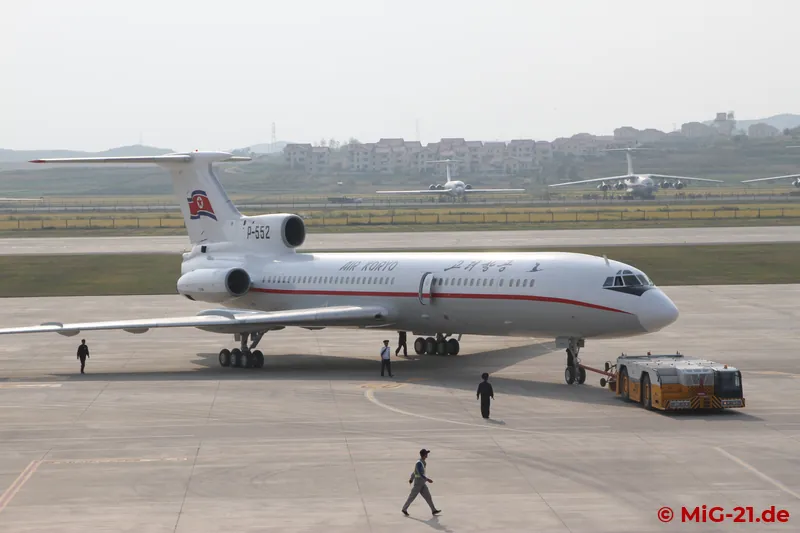 ... and a Tu-154 are made ready next to it to take the roughly 170 visitors to Wonsan. In the background …