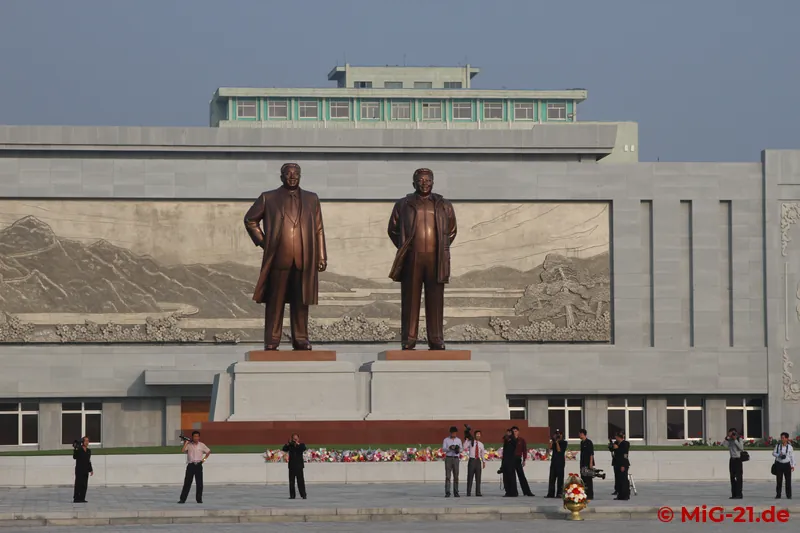 ... – no, still not to the airfield – to the monument of the Kims in the city centre, where we again have to …