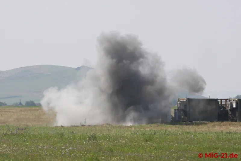 Then the first bomb "falls" on the "terrorists" entrenched in the radar station.