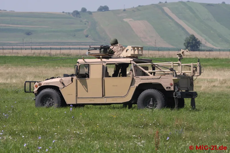 ... at the same time elite soldiers roll up in Humvees.