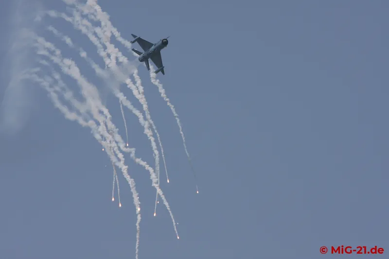 Above them the MiGs circle, firing huge numbers of flares ...