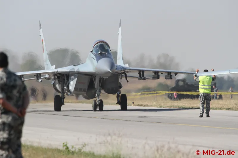 Two MiG-29s, which had given a mock air combat display, also parked on the perimeter taxiway right in front …